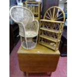 Twin flap dining table with interior cupboard, small basket weave peacock style chair and a bamboo