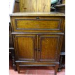 Polished wood cabinet with lift-up lid and twin beaded doors