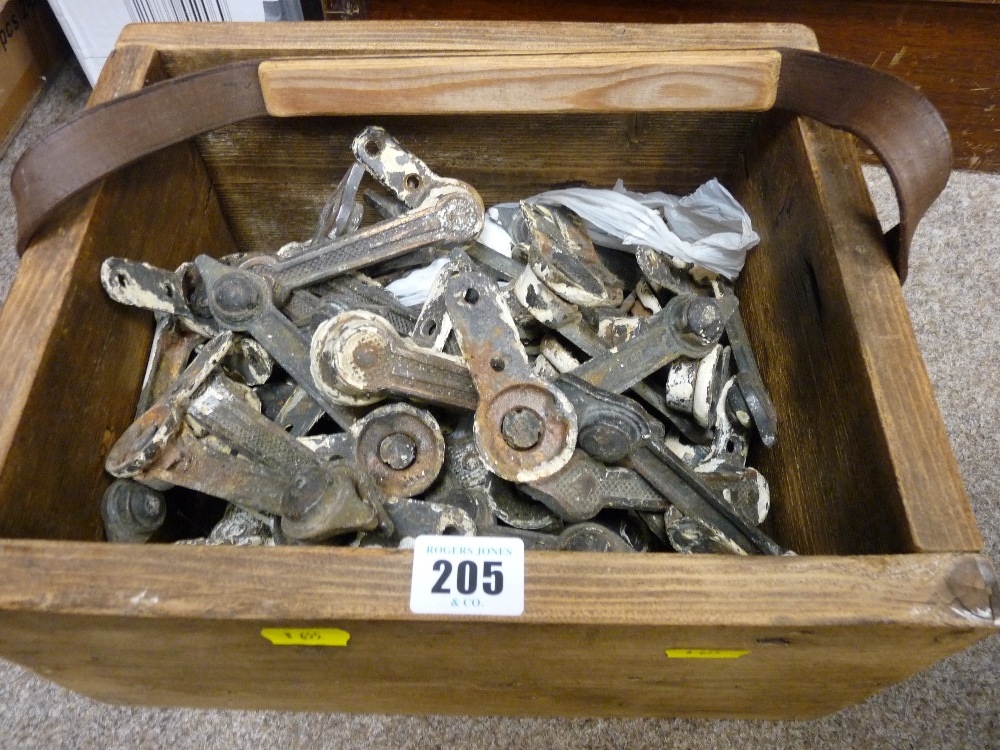 Wooden box of mixed ironmongery items (stair rod fixings?)