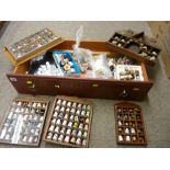 Wood drawer containing a large quantity of collector's thimbles, some in racks