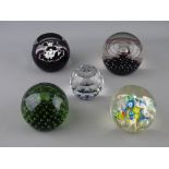 FIVE GLASS PAPERWEIGHTS - one circular blue tinted Swarovski of globe form, a limited edition (23/