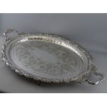 A FENTON BROTHERS LTD TWO HANDLED SILVER PLATED SERVING TRAY, chased decorated centre with shell and