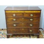 A GEORGIAN MAHOGANY CHEST OF TWO SHORT OVER THREE LONG DRAWERS below a burr walnut frieze, the