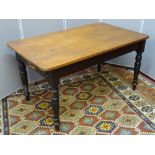 A VICTORIAN PINE SINGLE DRAWER KITCHEN TABLE on turned supports, 74 cms high, 137 cms long, 81.5 cms