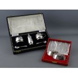 A CASED FIVE PIECE SILVER CONDIMENT SET and a boxed pair of German silver whisky labels,