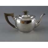 A BACHELOR'S SILVER TEAPOT, London 1917, maker Carrington & Co, with composite handle and lid