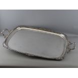 A LARGE RECTANGULAR TWO HANDLED SILVER PLATED SERVING TRAY by Joseph Rodgers & Sons, Sheffield, 74