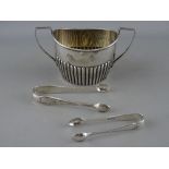 A REEDED TWO HANDLED SILVER SUGAR BASIN, Chester 1901 and two pairs of silver sugar tongs, London