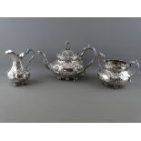 A VICTORIAN THREE PIECE SILVER TEASET, Sheffield 1855, 48.9 troy ozs gross, highly decorative with