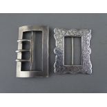 TWO VICTORIAN SILVER BUCKLES including a chased decorated example, maker Colin H Cheshire, the other