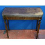 A REGENCY MAHOGANY FOLDING TEA TABLE on tapering turned supports, 74.5 cms high, 91 cms wide, 44.