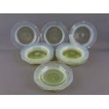 FIFTEEN VASELINE GLASS PLATES all with polished pontils, 14 and 14.5 cms diameters