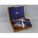 A FIGURED WALNUT & METAL MOUNTED CASED SET OF DRAWING INSTRUMENTS by Stanley, 3 Great Turnstile,