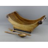 A 19th CENTURY MAHOGANY CHEESE COASTER and a pair of carved wooden servers, the coaster with