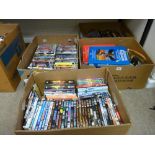 Four boxes of assorted DVDs