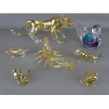 Collection of glass figurines including a tiger and four cubs, a duck and a scorpion