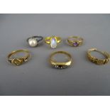 Two nine carat gold dress rings, 2.2 grms, an unmarked moonstone set ring, two eighteen carat gold