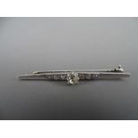 Art Deco style diamond set bar brooch, unmarked but believed tested white gold