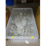 Lidded plastic crate of drinking glassware
