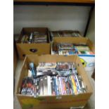 Four boxes containing very large quantity of DVDs (approx. 150-200)