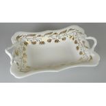 A SWANSEA PORCELAIN TWIG-HANDLED CENTRE DISH of shaped rectangular form, decorated in the gilded