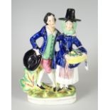 A STAFFORDSHIRE POTTERY FIGURE OF JENNY JONES & NED MORGAN modelled with Jenny in traditional