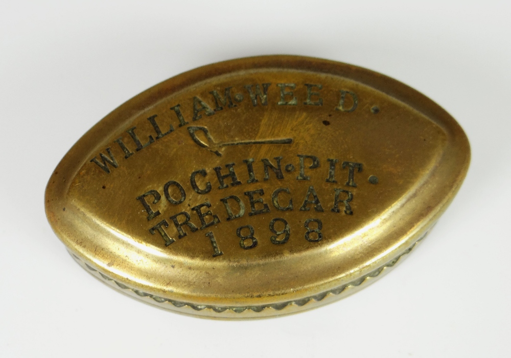 A VICTORIAN BRASS POINTED OVAL SNUFF BOX inscribed in block capitals 'William Weed Pochin Pit