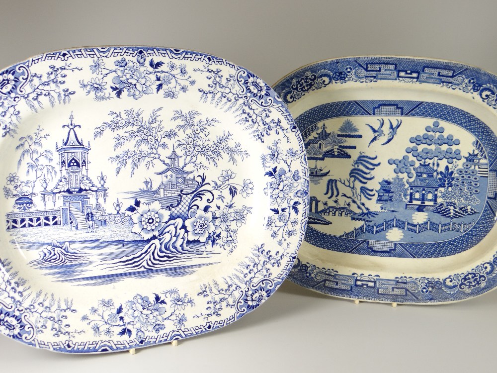 TWO NINETEENTH CENTURY WELSH POTTERY MEAT PLATTERS with blue and white transfer decoration, by
