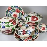 A LLANELLY POTTERY PERSIAN ROSE PART DINNER SET including two lidded tureens, dish plates, small