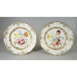 A PAIR OF SWANSEA PORCELAIN DESSERT PLATES with lobed rim and having a moulded border with C-