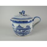 A Chinese blue & white export lidded jug, the lid with Dog of Fo finial and decorated with village