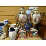 A pair of Vienna-style covered vases on plinths, a Davenport stoneware hunting scene jug with floral