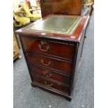 A reproduction two-drawer mahogany effect filing cabinet with tooled leather insert top Condition