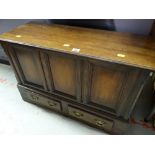 A small antique-reproduction coffer-bach having a hinged lid with two drawers in the base, 53cms h x