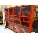 A pair of red IKEA display cabinets, a parcel of mirrors and two further narrow display cabinets