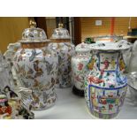 A pair of large Oriental-style lidded vases, a modern Famille Rose vase and a Bavarian lidded vase