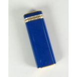A Cartier blue enamel and white / yellow metal decorated cigarette lighter No.70560 Condition
