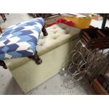 A vintage light green dralon ottoman, small footstool, large rug and wine racks together with a