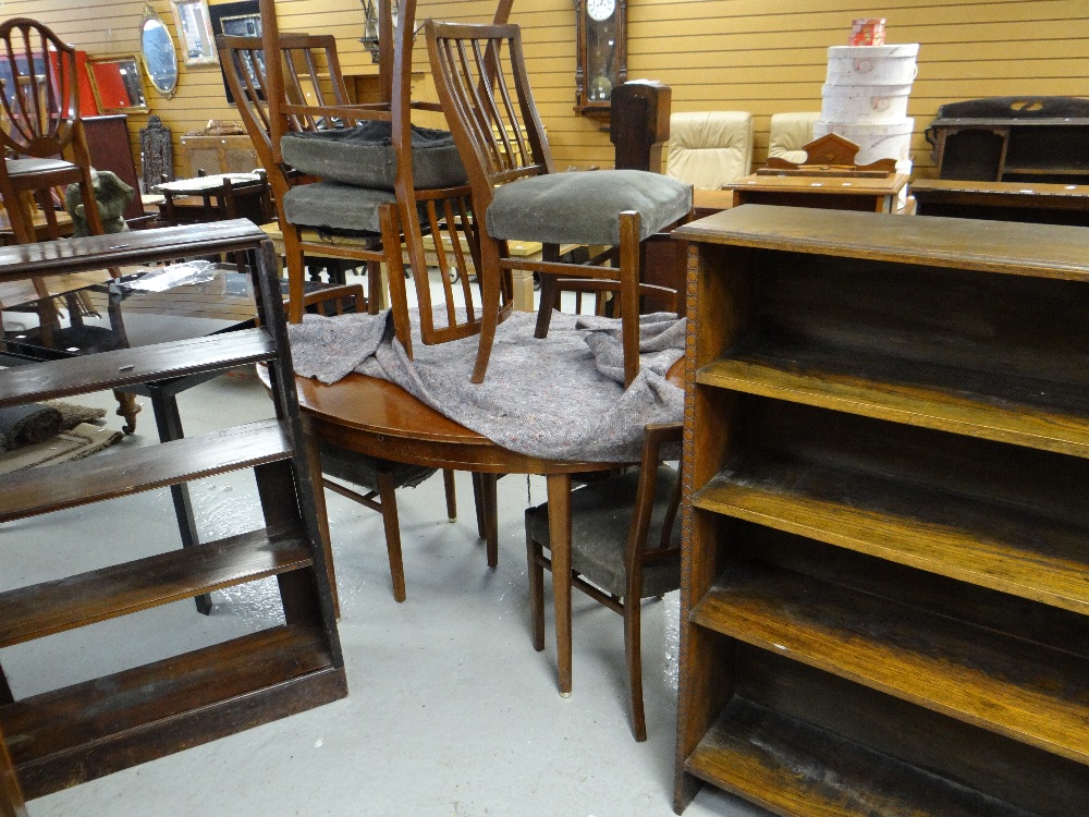 Two vintage open bookcases and an oval dining table and chairs Condition reports provided on request