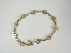 A 9ct yellow gold daisy bracelet, 6gms Condition reports provided on request by email for this