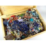 A wooden box containing a large parcel of mixed costume jewellery, beads ETC Condition reports