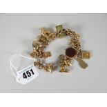 9ct gold flat curb link bracelet with assorted charms to include revolving blood stone fob, one