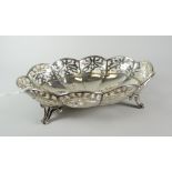 Solid silver pierced bon-bon dish raised on four scroll-type feet, London hallmarked, makers initals