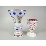 A milk glass floral decorated goblet shaped vase & another Condition reports provided on request