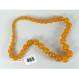 Amber graduated beads, 60cms long Condition reports provided on request by email for this auction