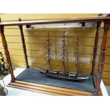 Cased three-masted model ship with paperwork (ship 53 x 79cms, case 68 x 98cms) Condition reports