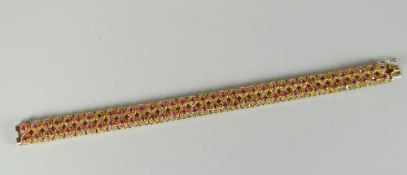 18ct gold two-row ruby bracelet (one stone missing), 29grams Condition reports provided on request