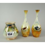 A Royal Worcester footed vase of lobed form and with narrow neck decorated with yellow and pink