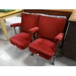 A pair of vintage numbered red upholstered folding cinema-seats removed from a South Wales cinema