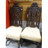 A pair of carved cushion seated antique hall chairs Condition reports provided on request by email